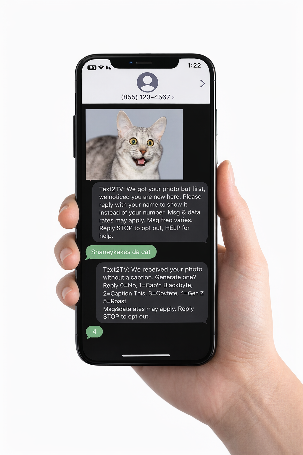 Hand holding phone showing Text2TV SMS conversation
